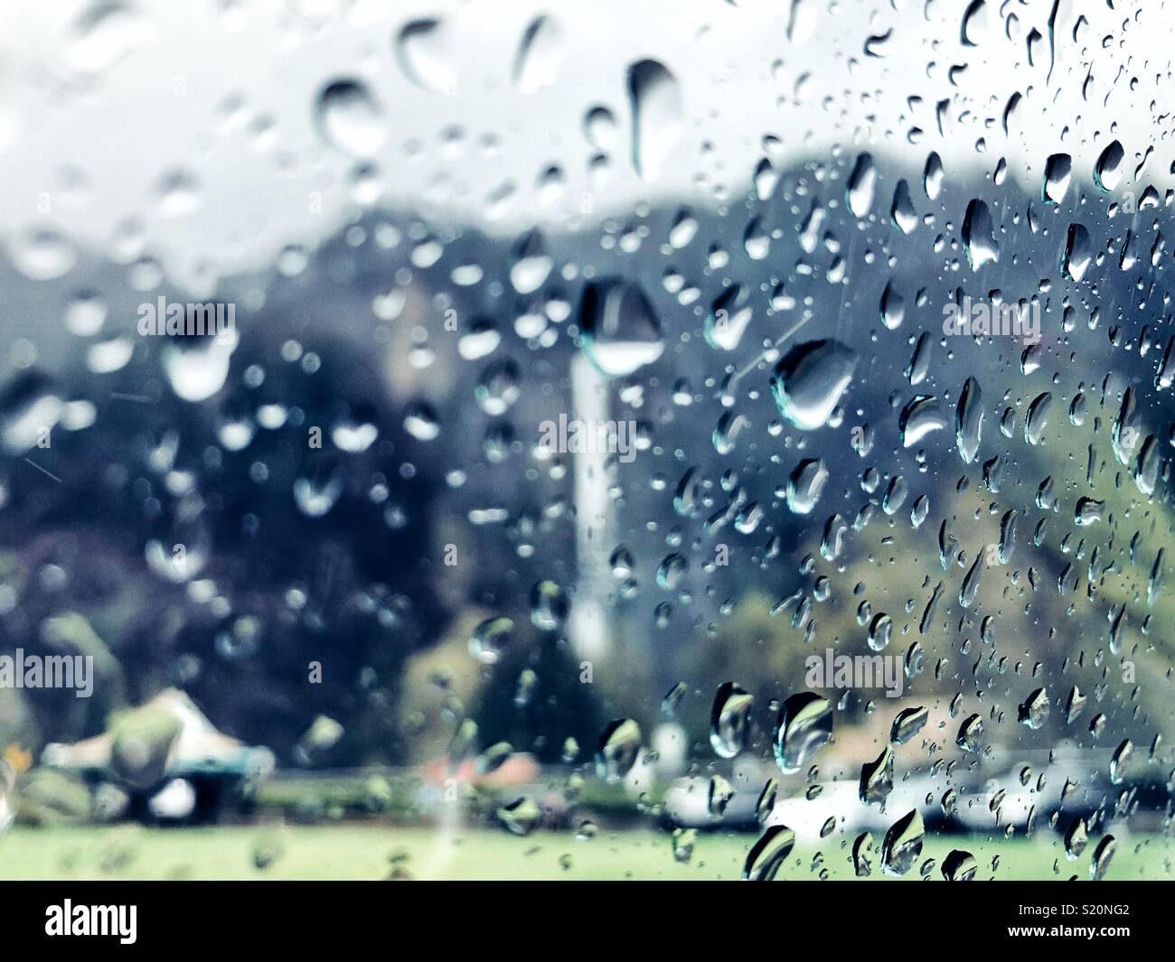 Famous Multnomah waterfall near Portland, Oregon, seen through rainy car window - Smartphone Captured Stock Image