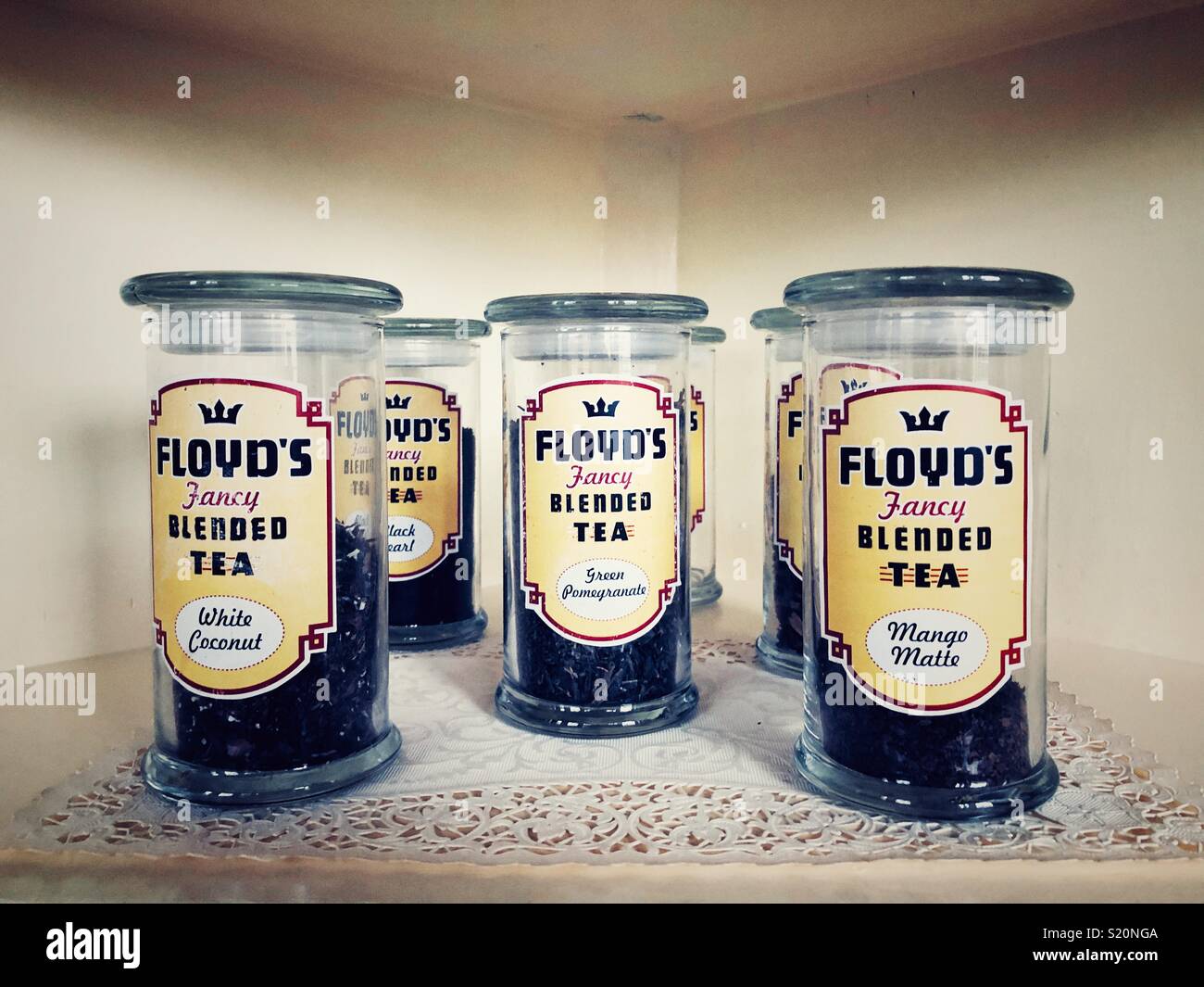 Fancy Floyd’s blended teas in vintage glass containers on a shelf Stock Photo