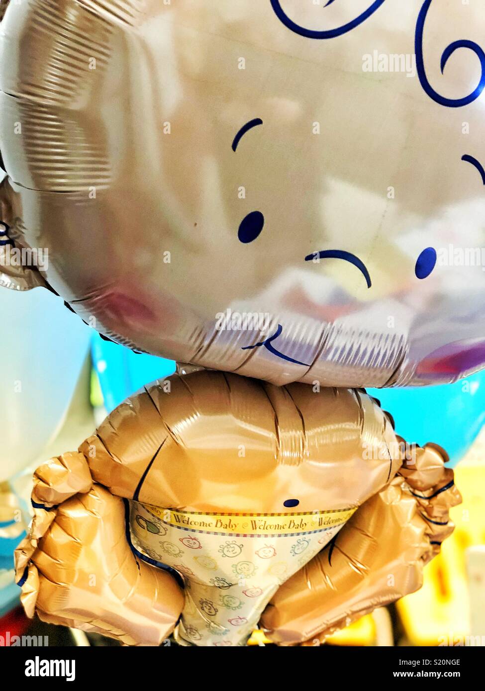 Baby boy shaped balloon at baby shower - Smartphone Captured Stock Image