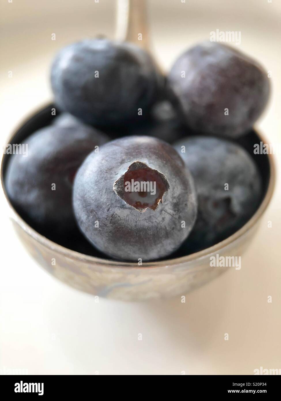 Tablespoon of blueberries Stock Photo