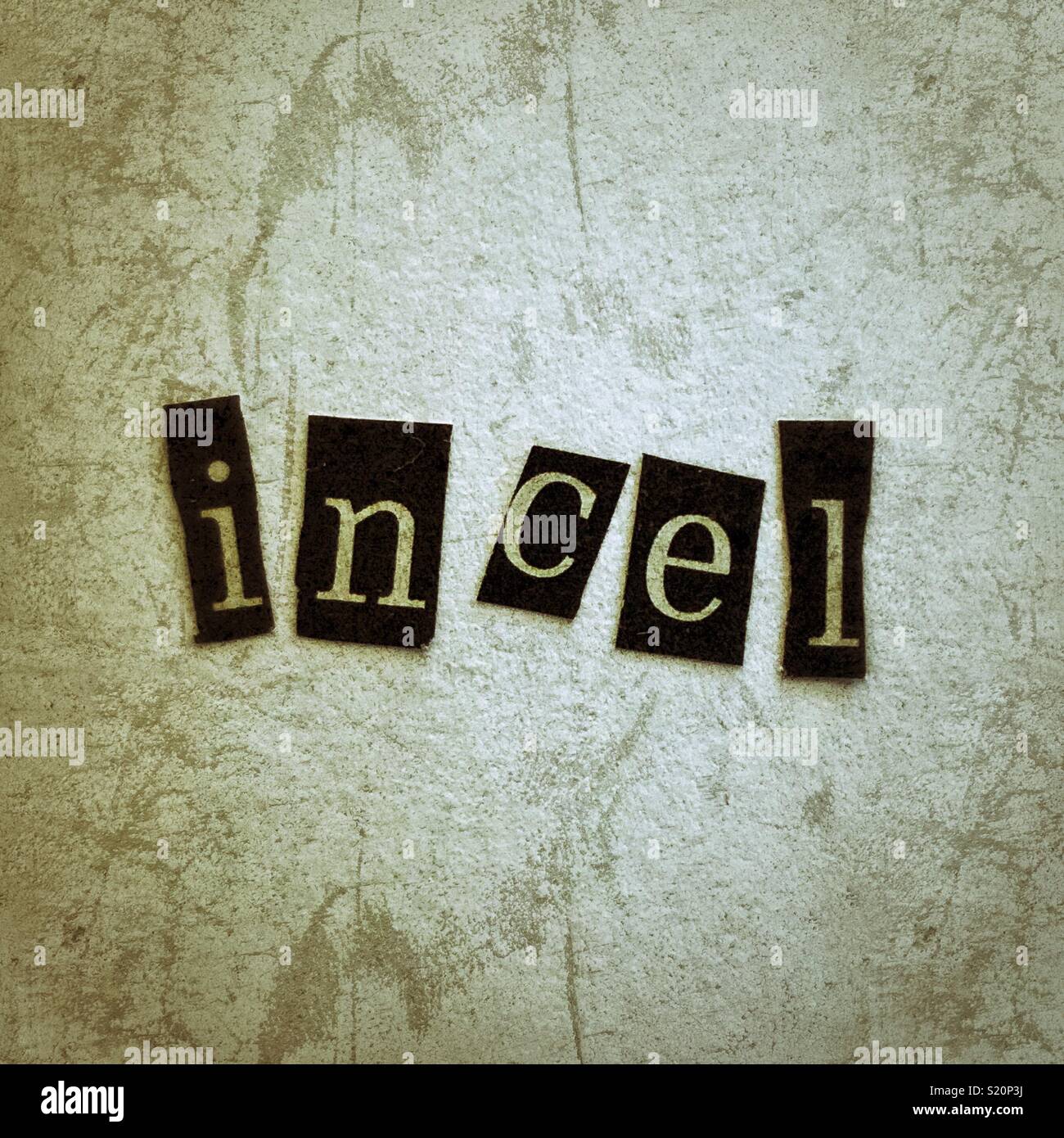 The word “incel”, which stands for involuntarily celibate, made with lowercase letters cut out of a magazine Stock Photo