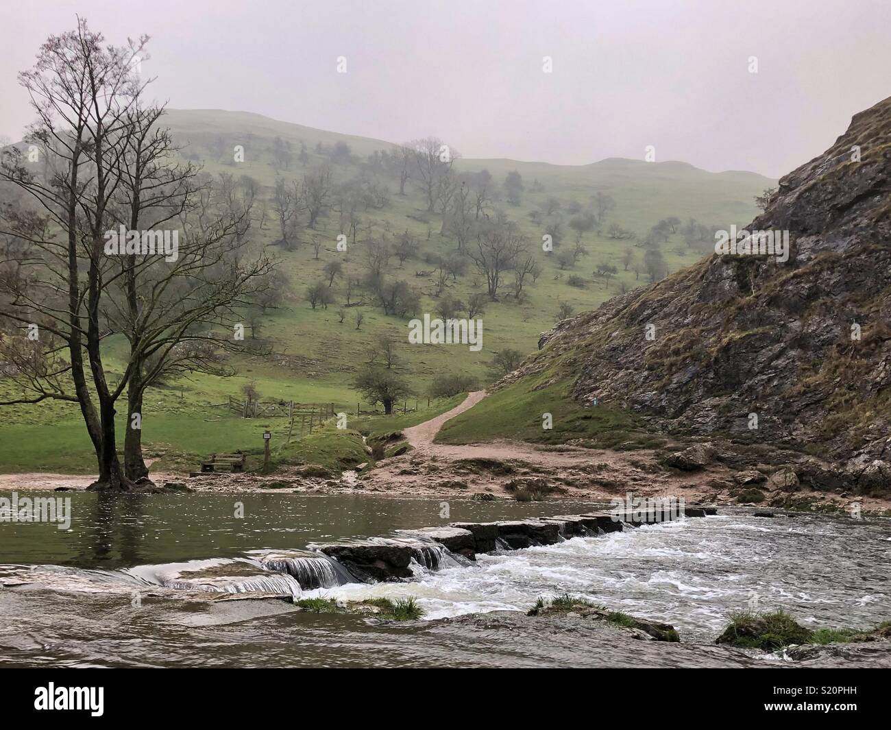 River stepping stones at Dovedale on a misty wintery day Stock Photo