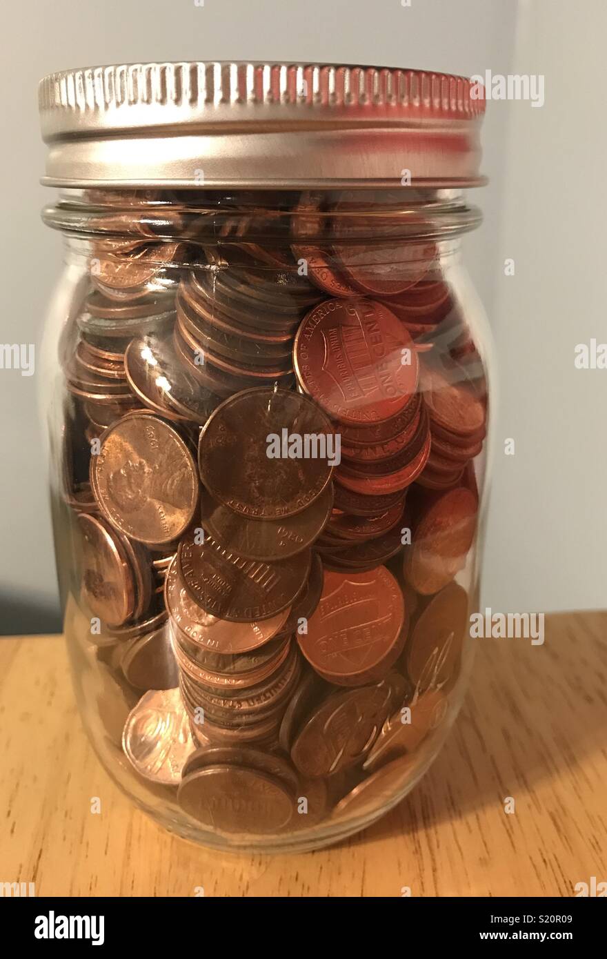 Jar full of pennies Stock Photo