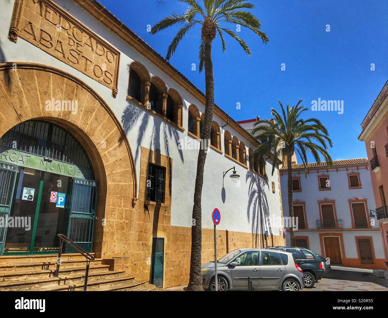 Municipal covered market and tall palms, in the Old Town area of Javea / Xabia on the Costa Blanca, Spain - Smartphone Captured Stock Image