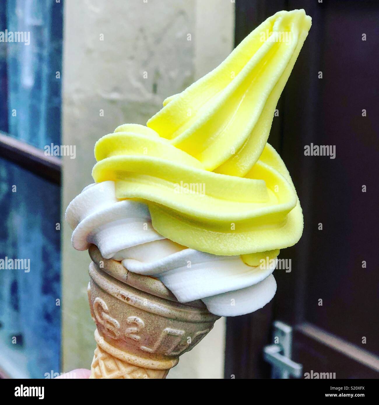 Scoop of refreshing lemon sorbet icecream with zest and mint on a white  background Stock Photo - Alamy