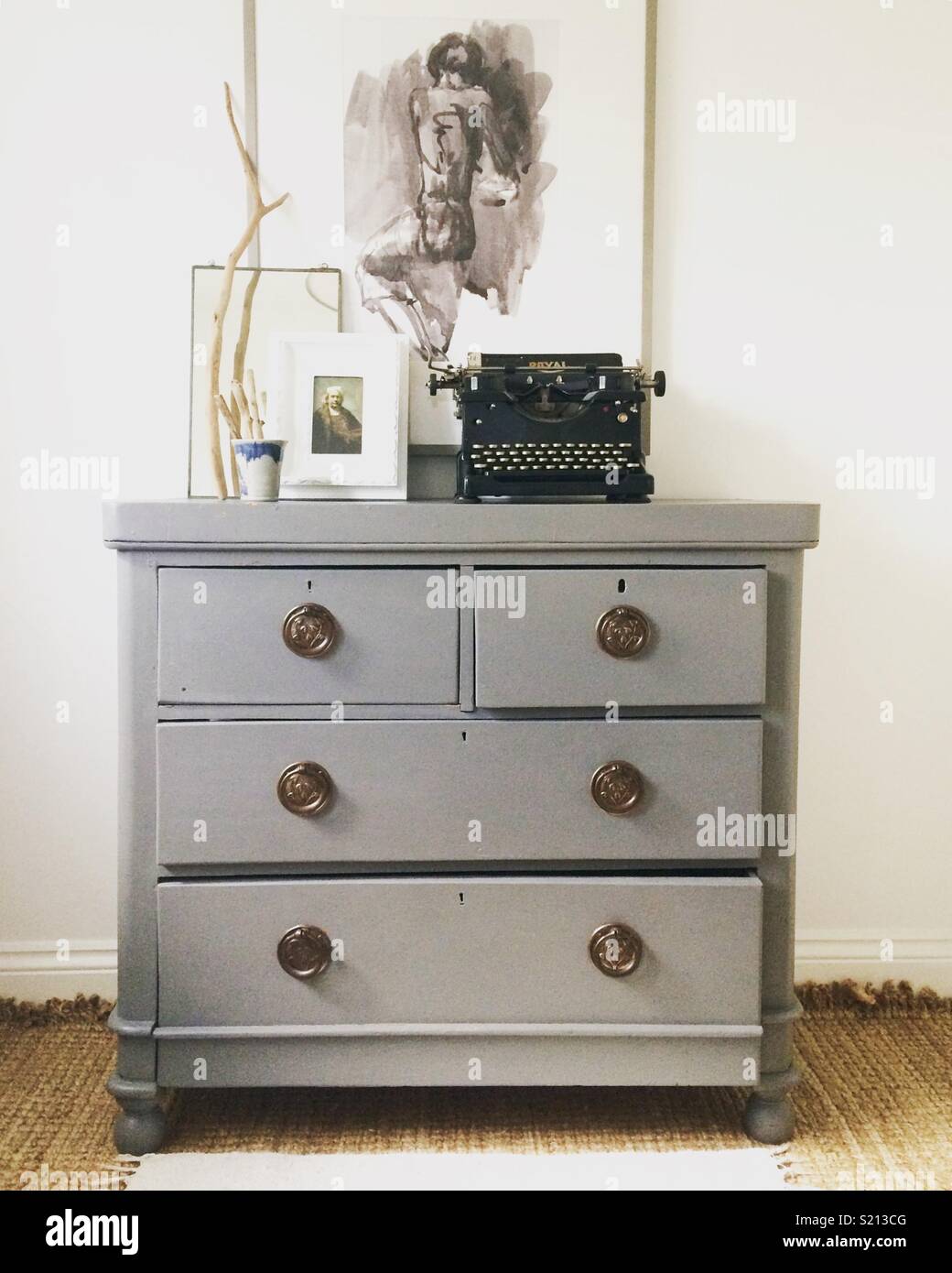 Painted Antique Chest Of Drawers And Old Typewriter Stock Photo