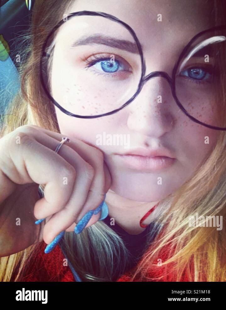 Girl with blue eyes and snapchat filter Stock Photo - Alamy