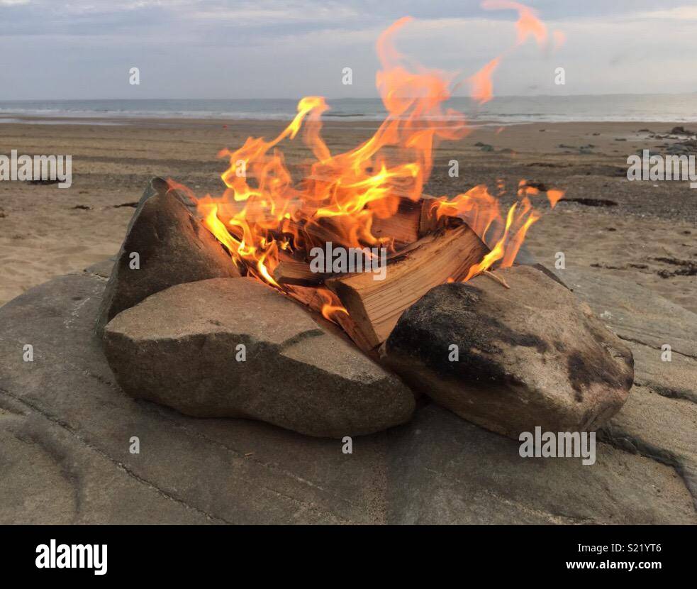Camp fire on the beach Stock Photo Alamy