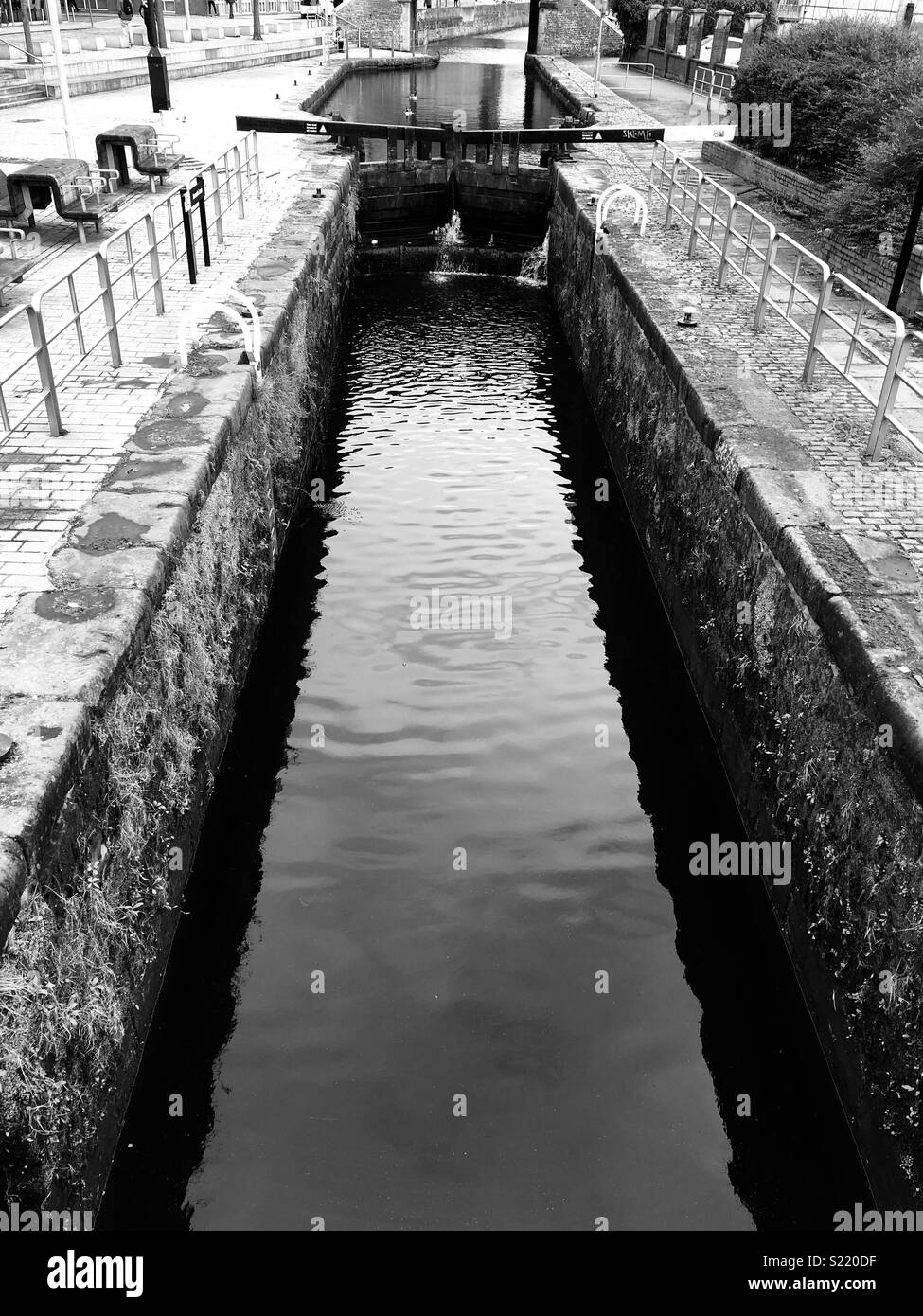 Canal lock in Manchester in black and white Stock Photo