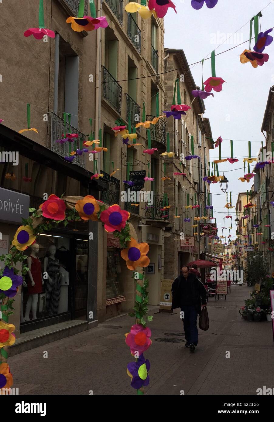 French street decorated with flowers Stock Photo - Alamy