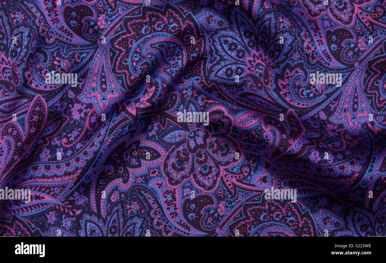 Paisley print fabric with creases in purple silk Stock Photo