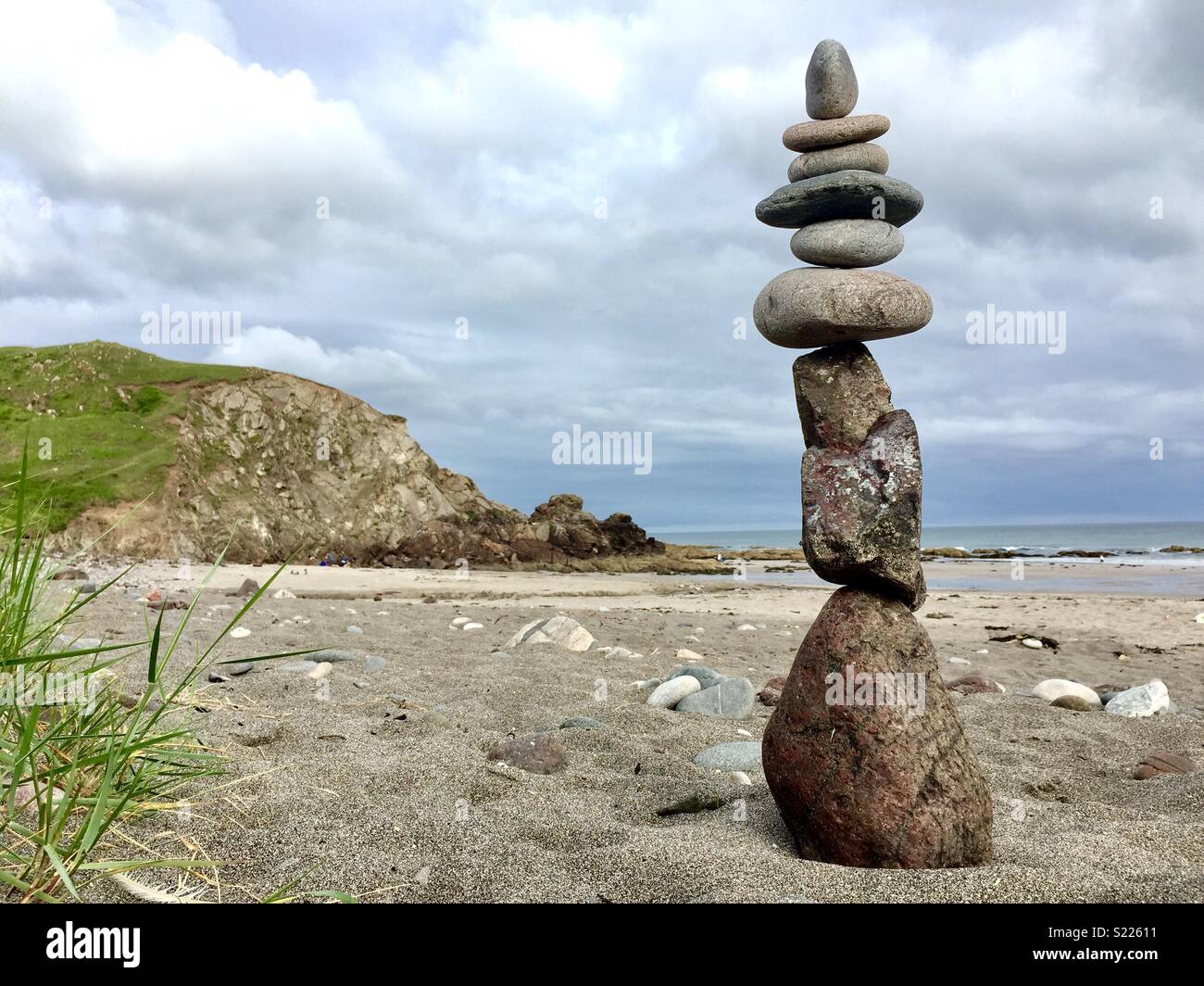 Rock balancing sculpture on beach in Cornwall. - Smartphone Captured Stock Image