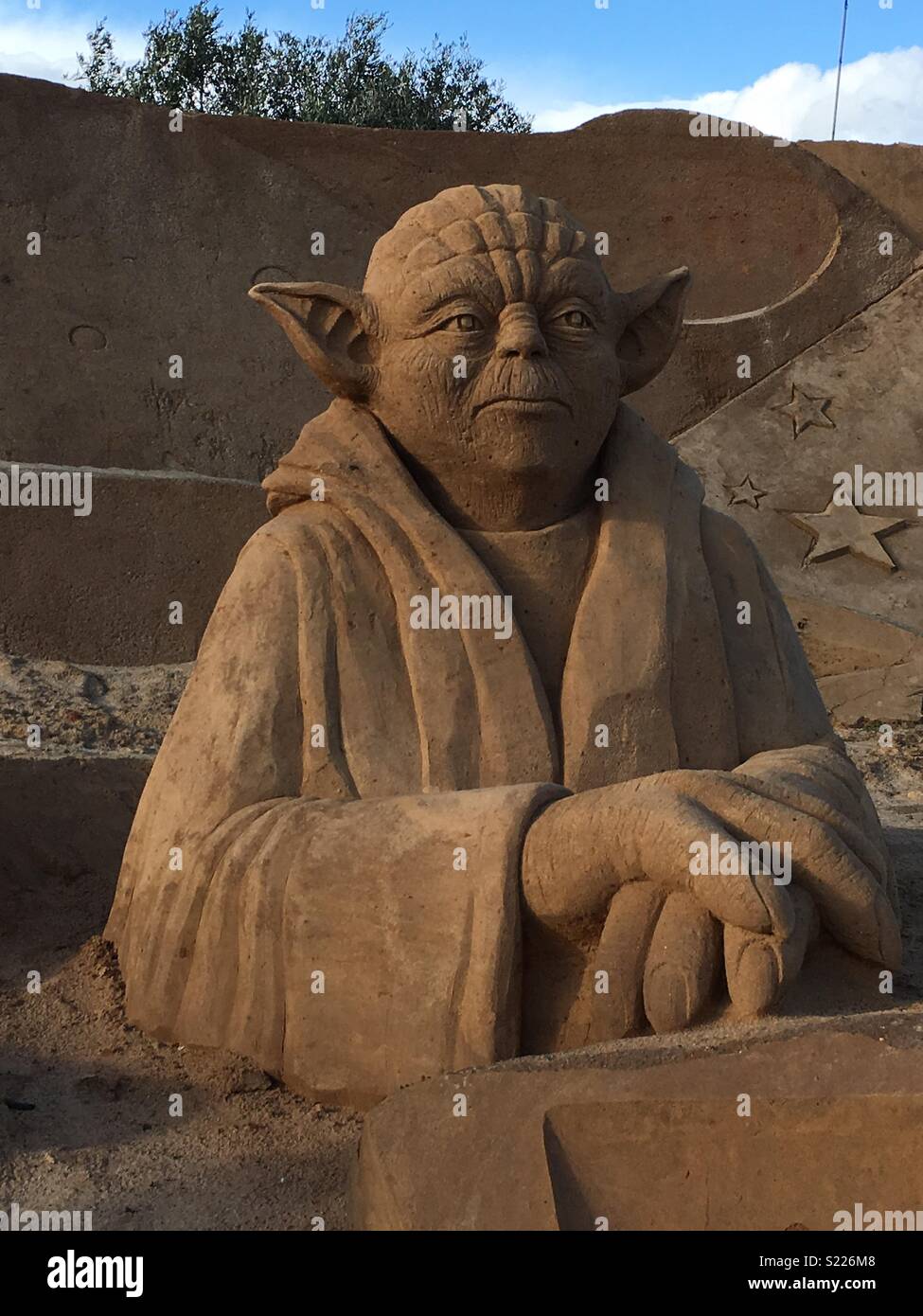 Yoda Star Wars sand sculpture taken at FIESA Sand Sculpture Festival in Pera, Portugal Stock Photo