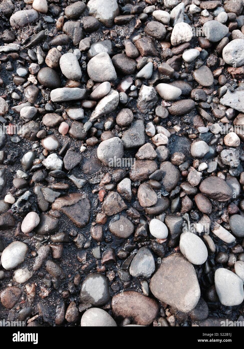 Pebble Rocks Between Stones, pebbles and rocks Stock Photo - Alamy