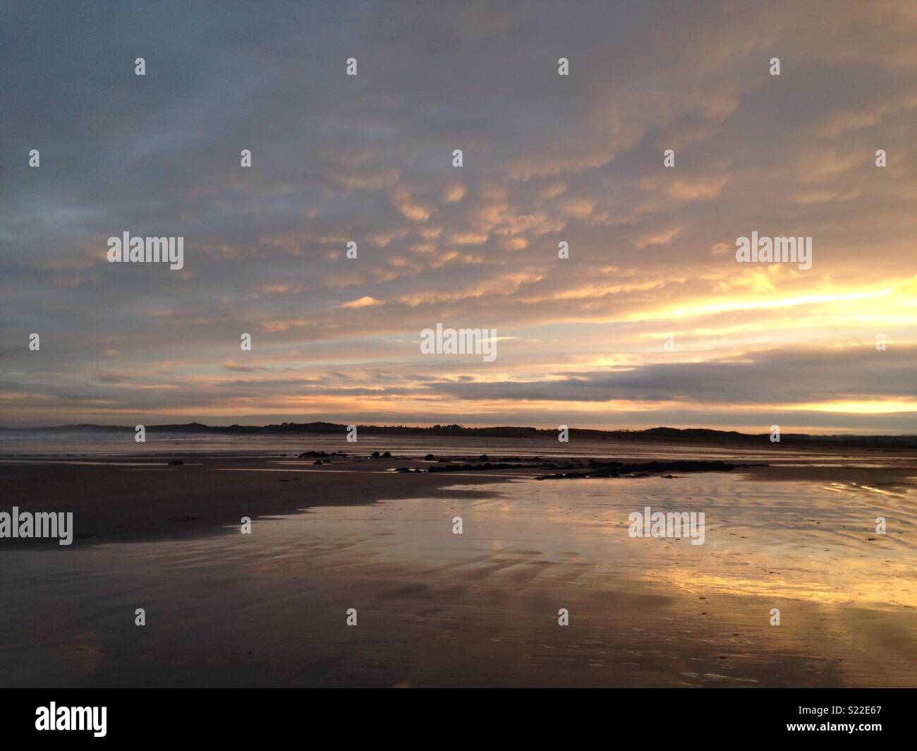 Beadnell beach at sunset Stock Photo