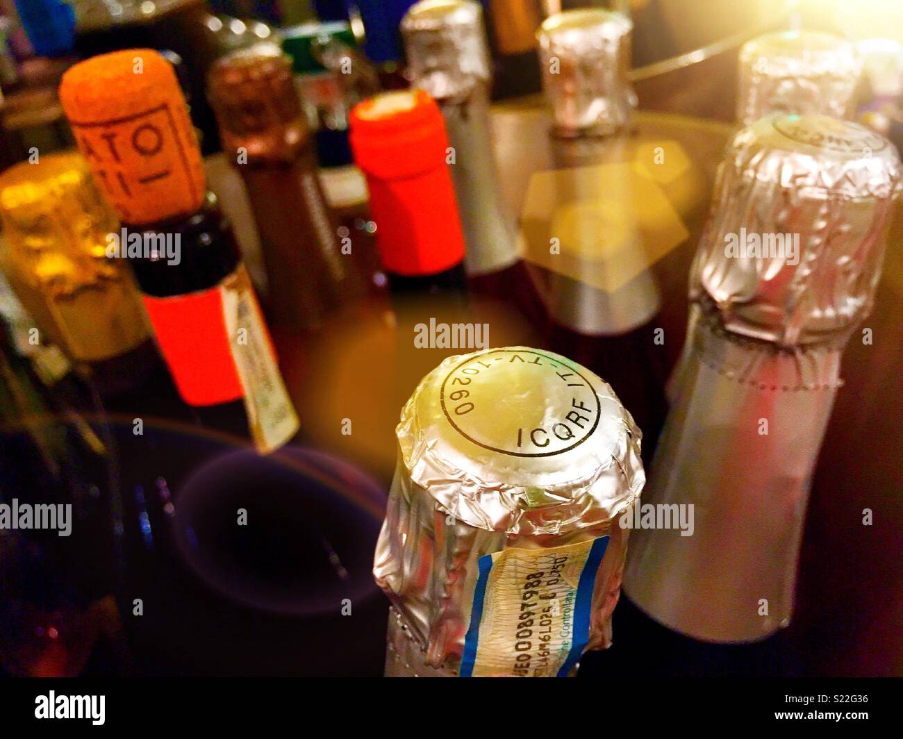 Tops  of wine bottles in a display tub, USA - Smartphone Captured Stock Image
