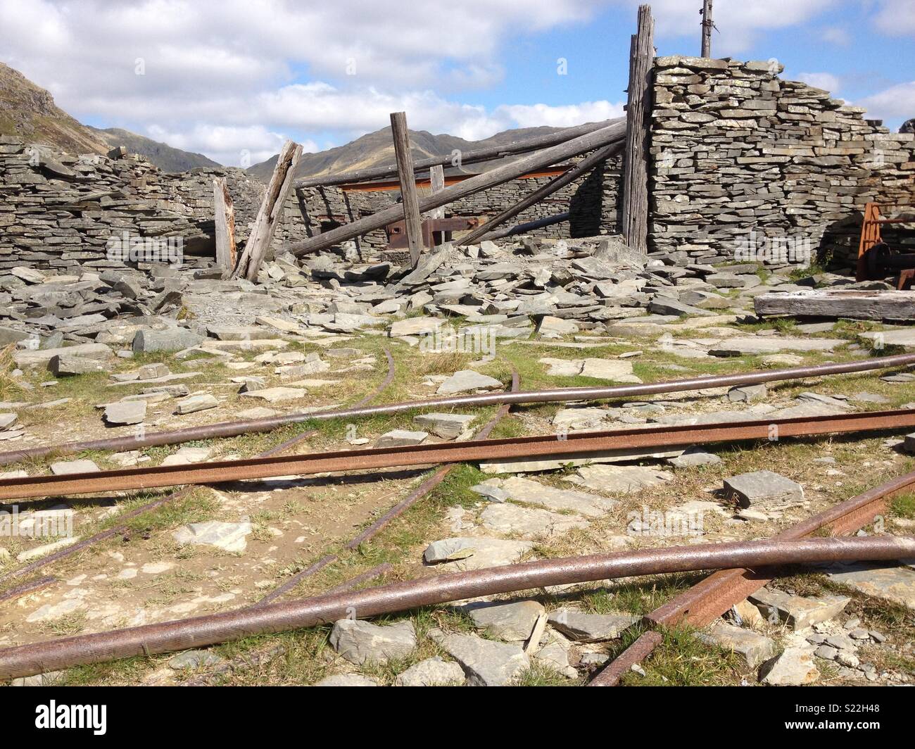Abandoned metal work structures on mountain Stock Photo