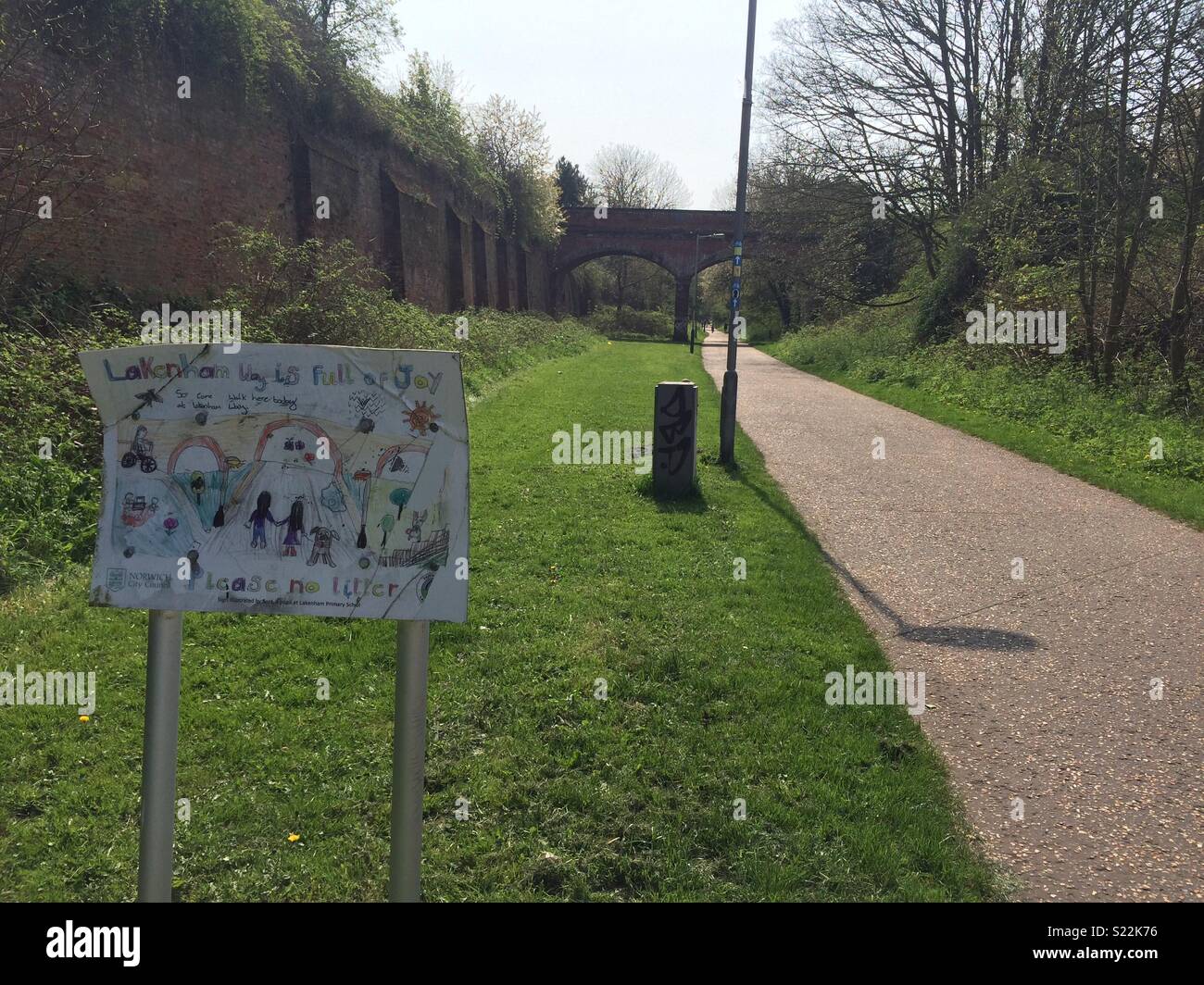 North end of a Lakenham Way in Norwich. View of worn sign made by school children towards old railway bridge. Stock Photo