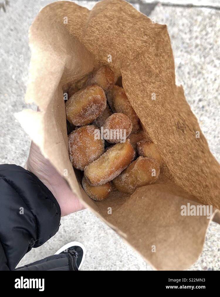 Brown bag full of sugar covered pretzel bites Stock Photo