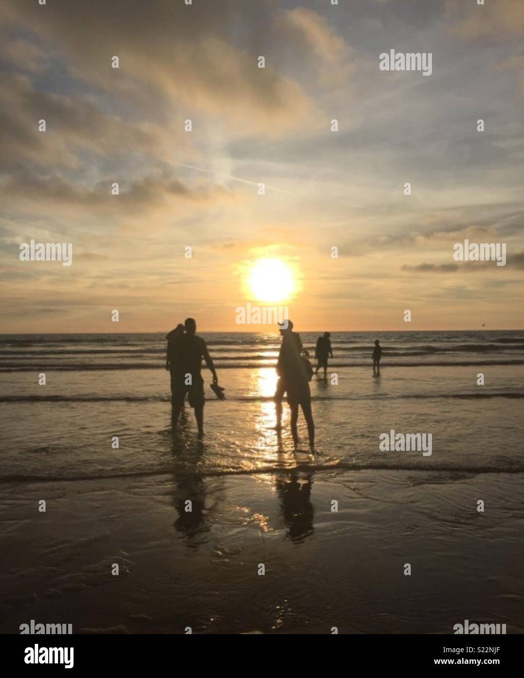 Sunset on beach Stock Photo - Alamy