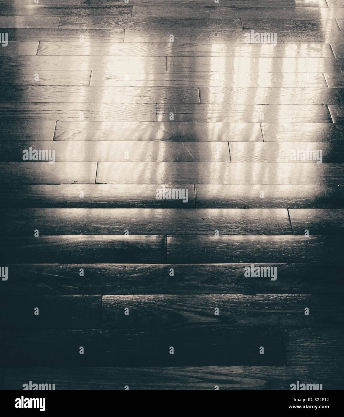 Reflection of day-lit window on an oak wooden floor - Smartphone Captured Stock Image