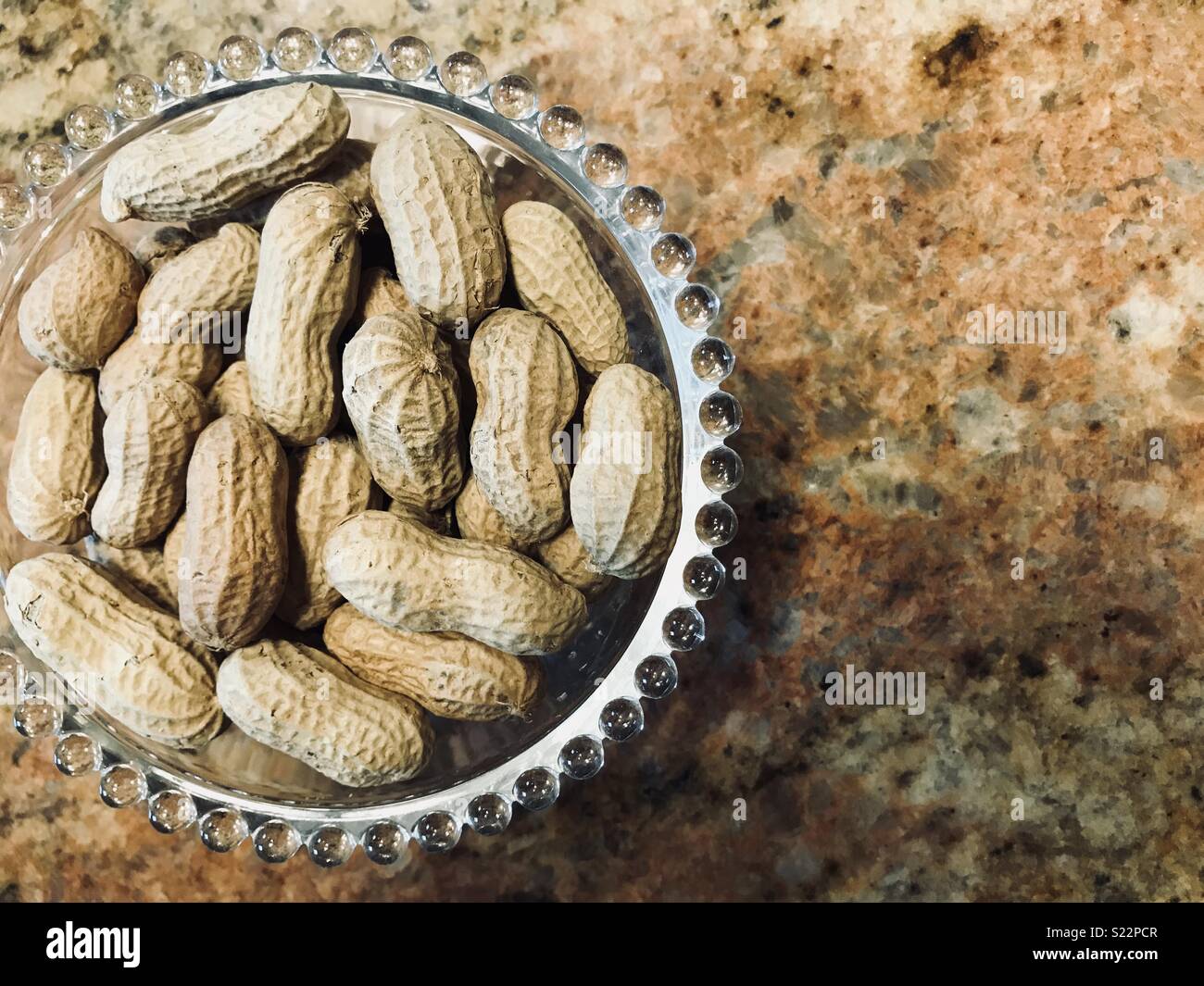 Bowl of peanuts Stock Photo