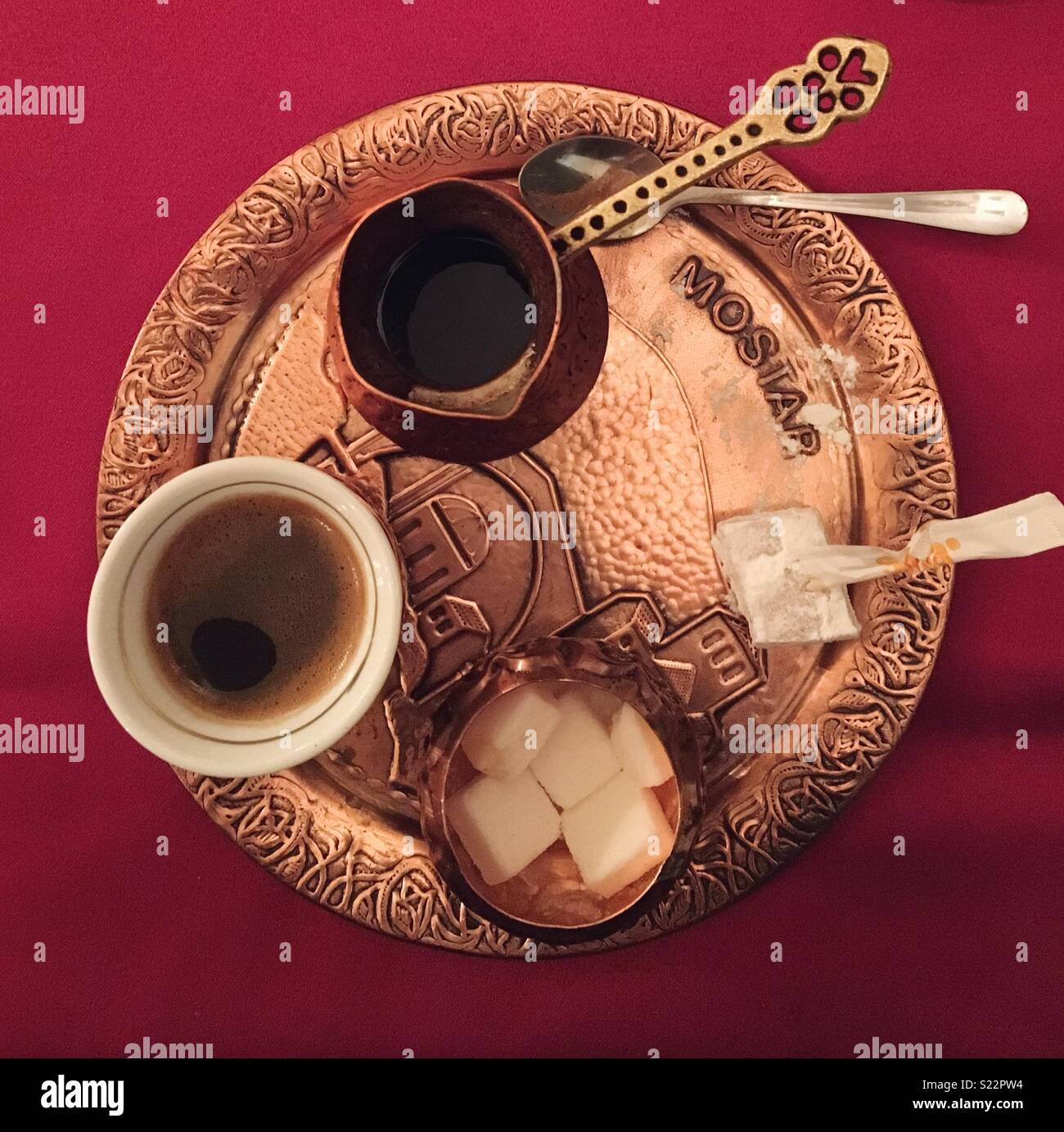 Bosnian coffee in a traditional beaten copper set, in Mostar - Smartphone Captured Stock Image