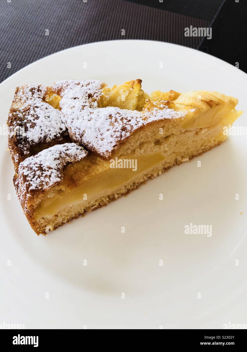 Apple cake with icing sugar on top - Smartphone Captured Stock Image