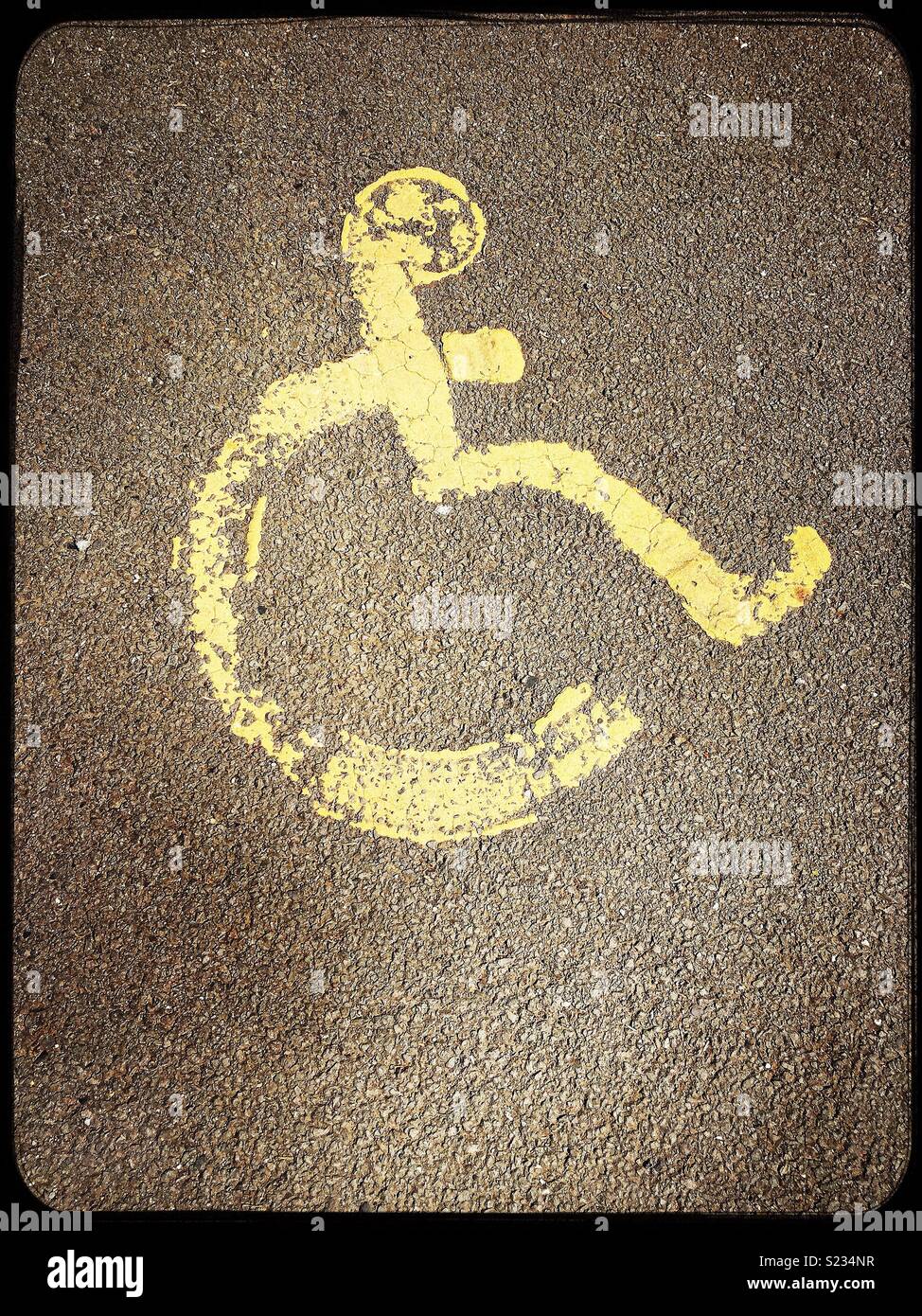 Disabled sign on parking spot/road. - Smartphone Captured Stock Image
