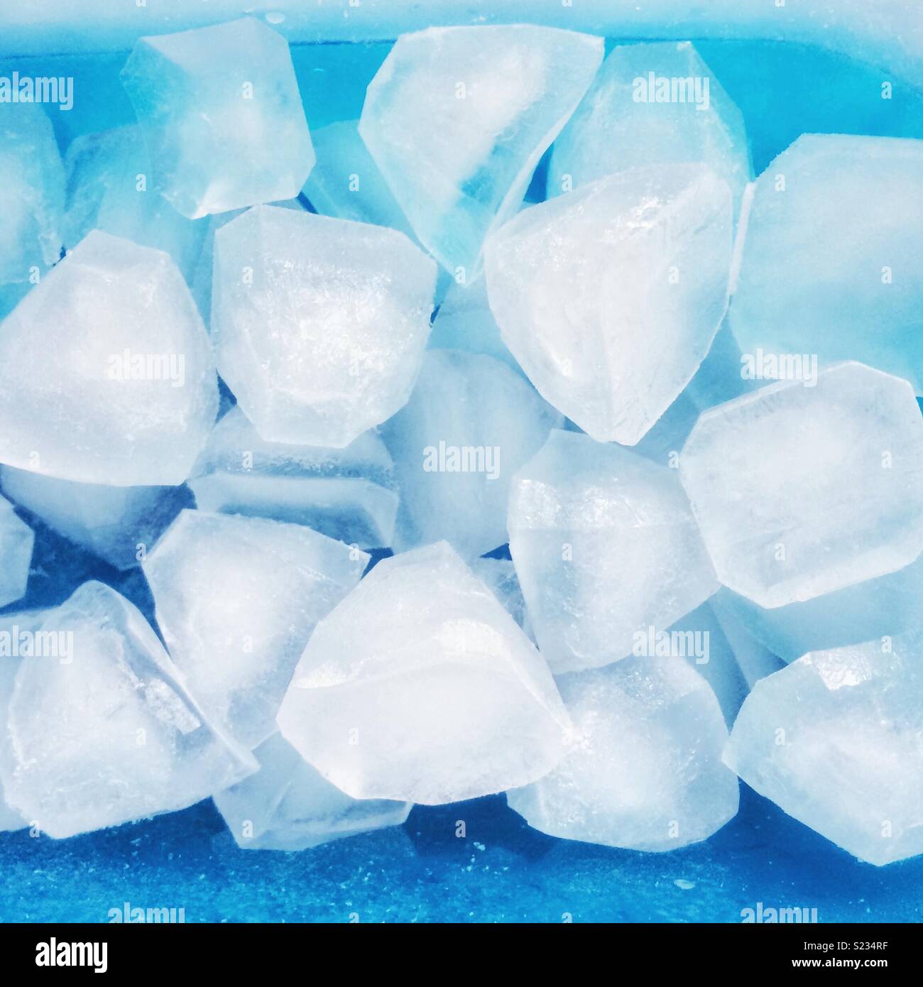 Ice cubes on blue background - Smartphone Captured Stock Image