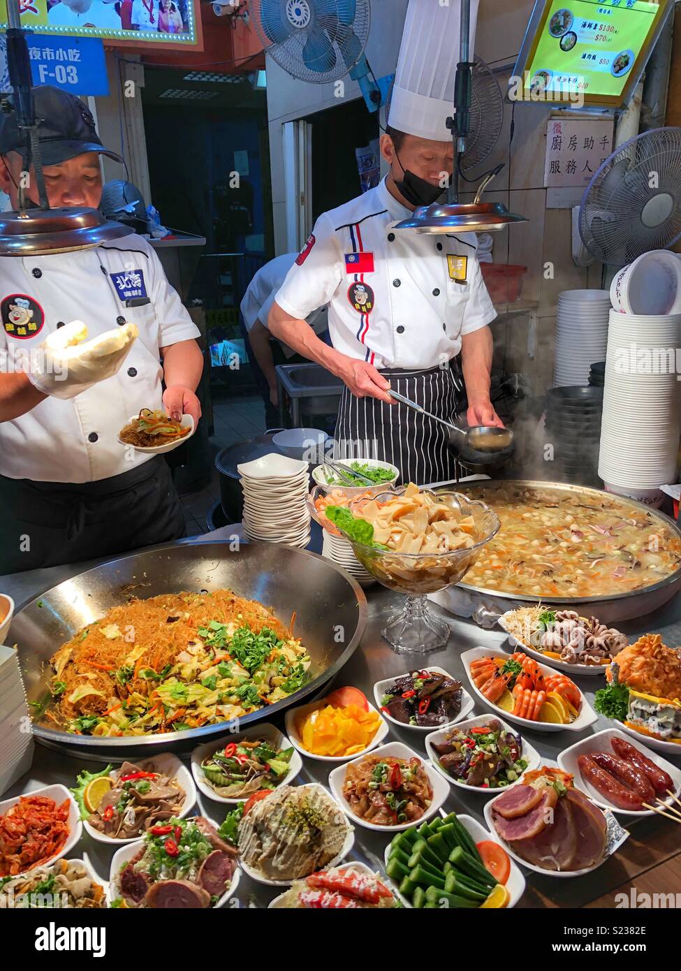 Cooks at a Taipei street market. - Smartphone Captured Stock Image