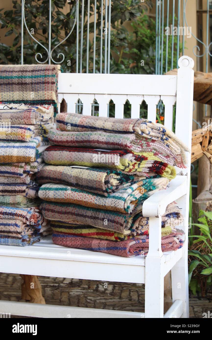 Blankets on a bench Stock Photo Alamy