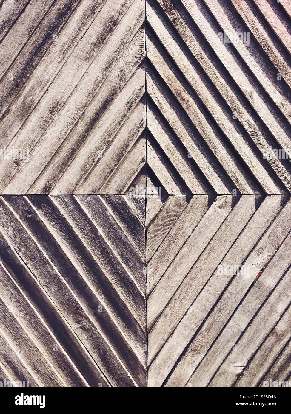 Geometric concentric diamonds in wood pattern. - Smartphone Captured Stock Image
