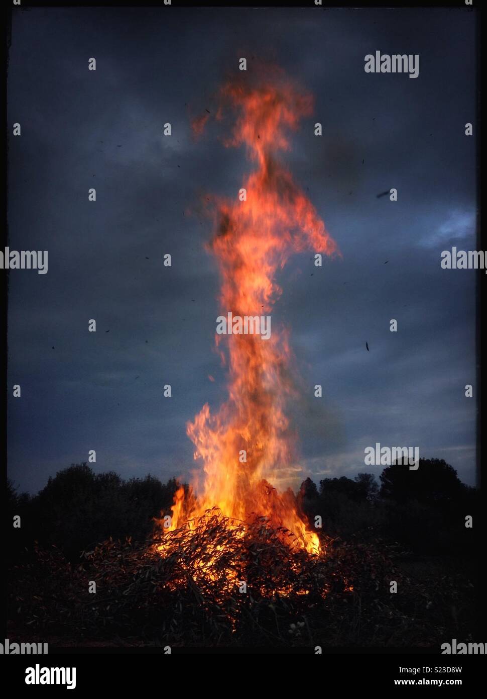 Bonfire with devilish figure... - Smartphone Captured Stock Image