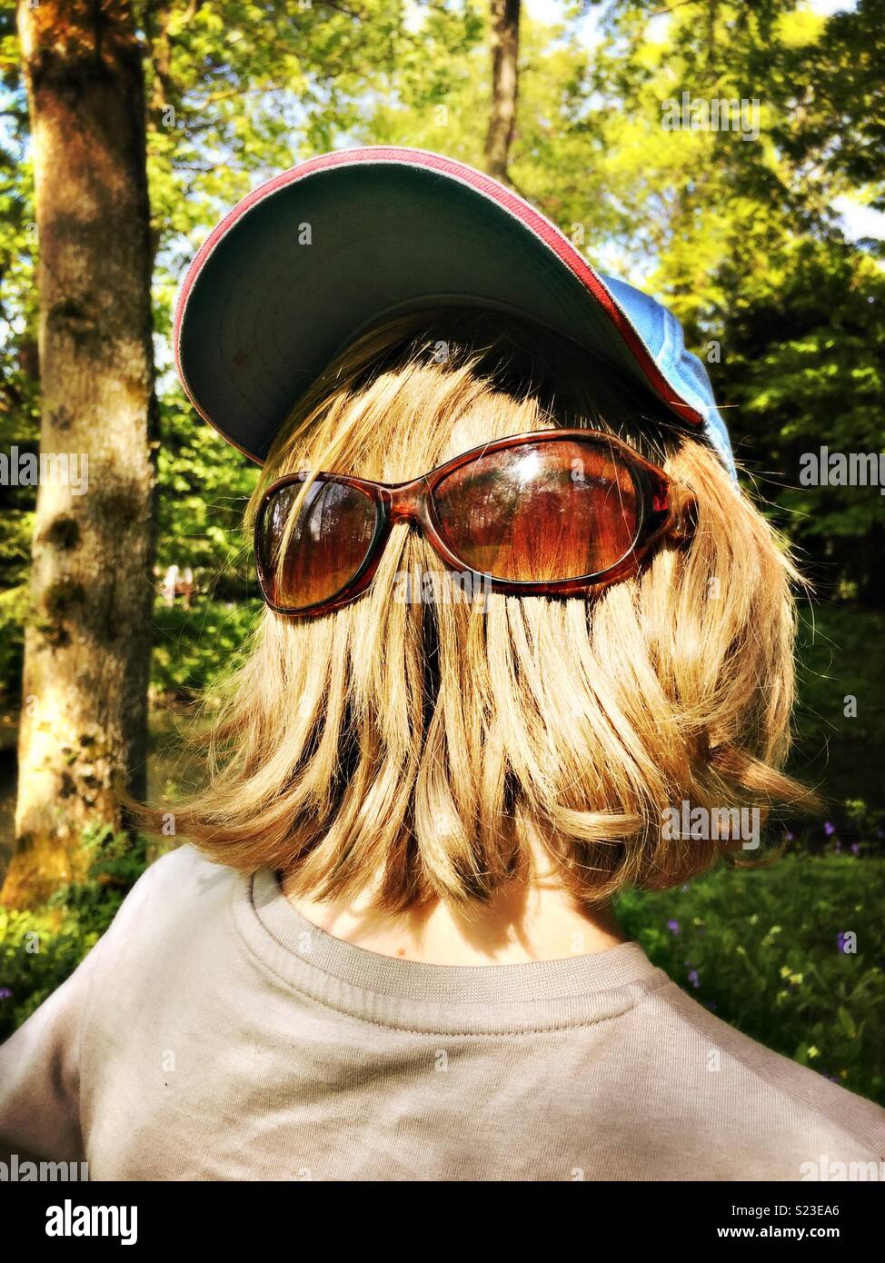 Hairy face with sunglasses resembling Chewbacca. Stock Photo