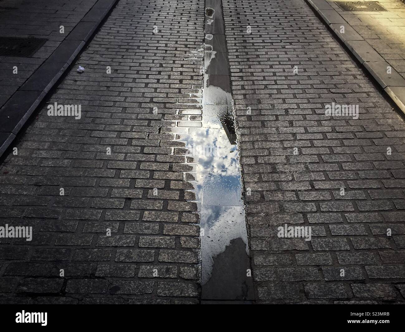 Reflection of the sky in a puddle - Smartphone Captured Stock Image