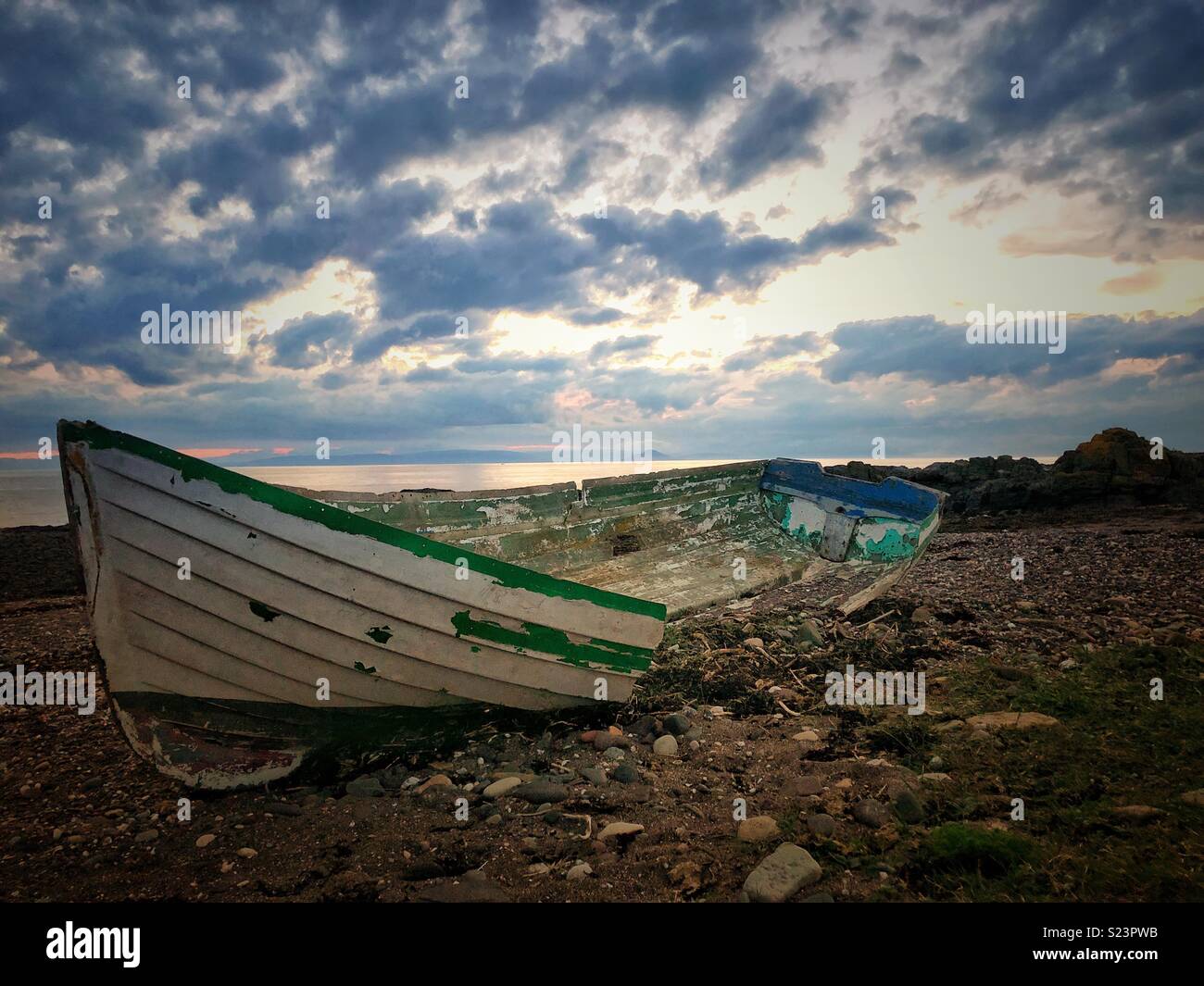 Old wooden boat broken up on beach Stock Photo - Alamy