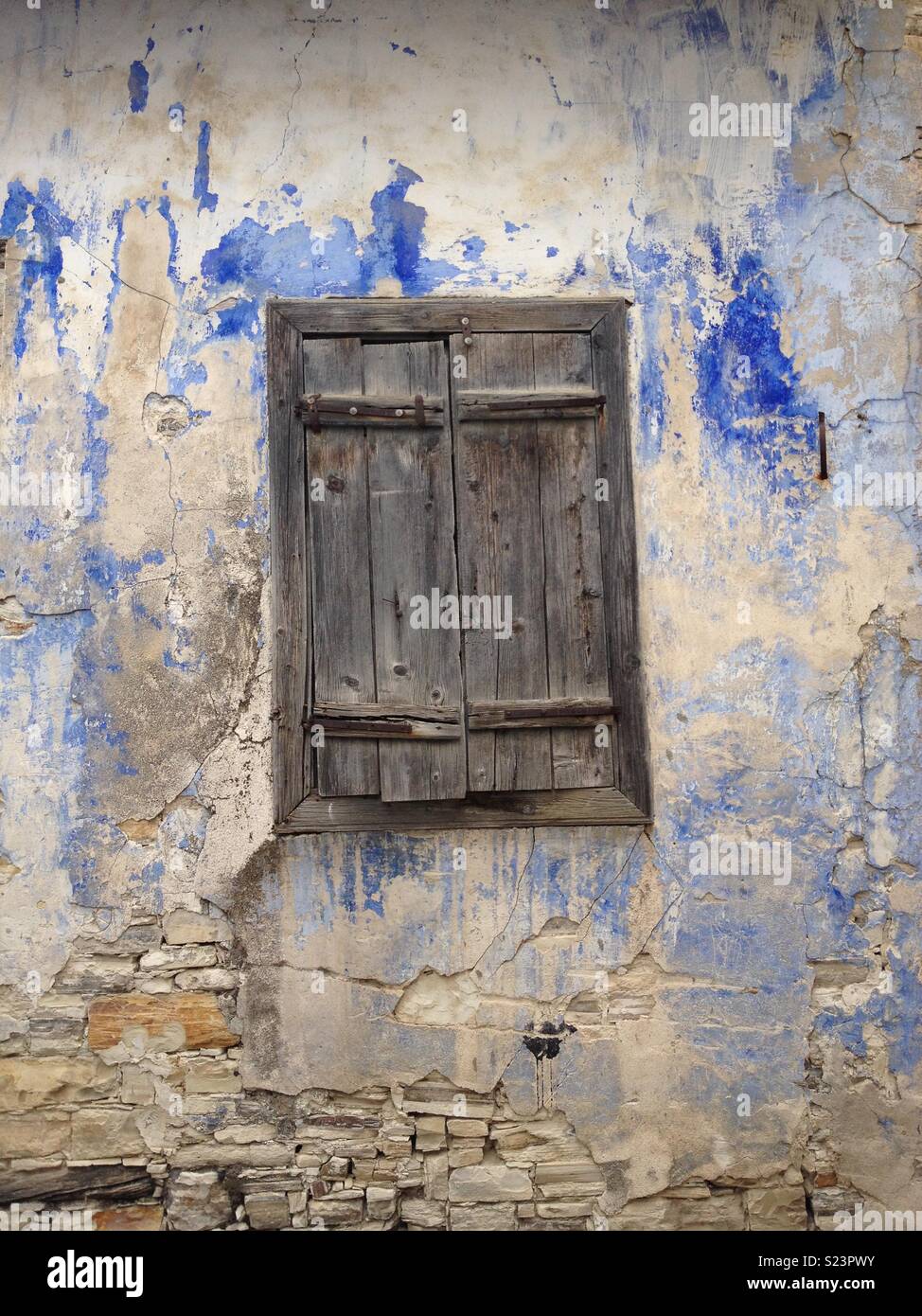 Old window and textured wall in a village in Cyprus - Smartphone Captured Stock Image