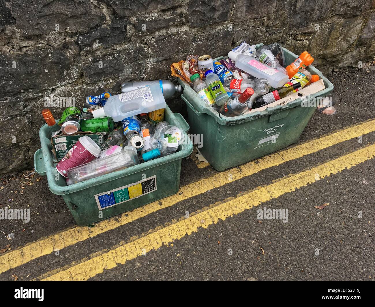 Recycling boxes awaiting collection by the roadside in Weston-super-Mare, UK - Smartphone Captured Stock Image