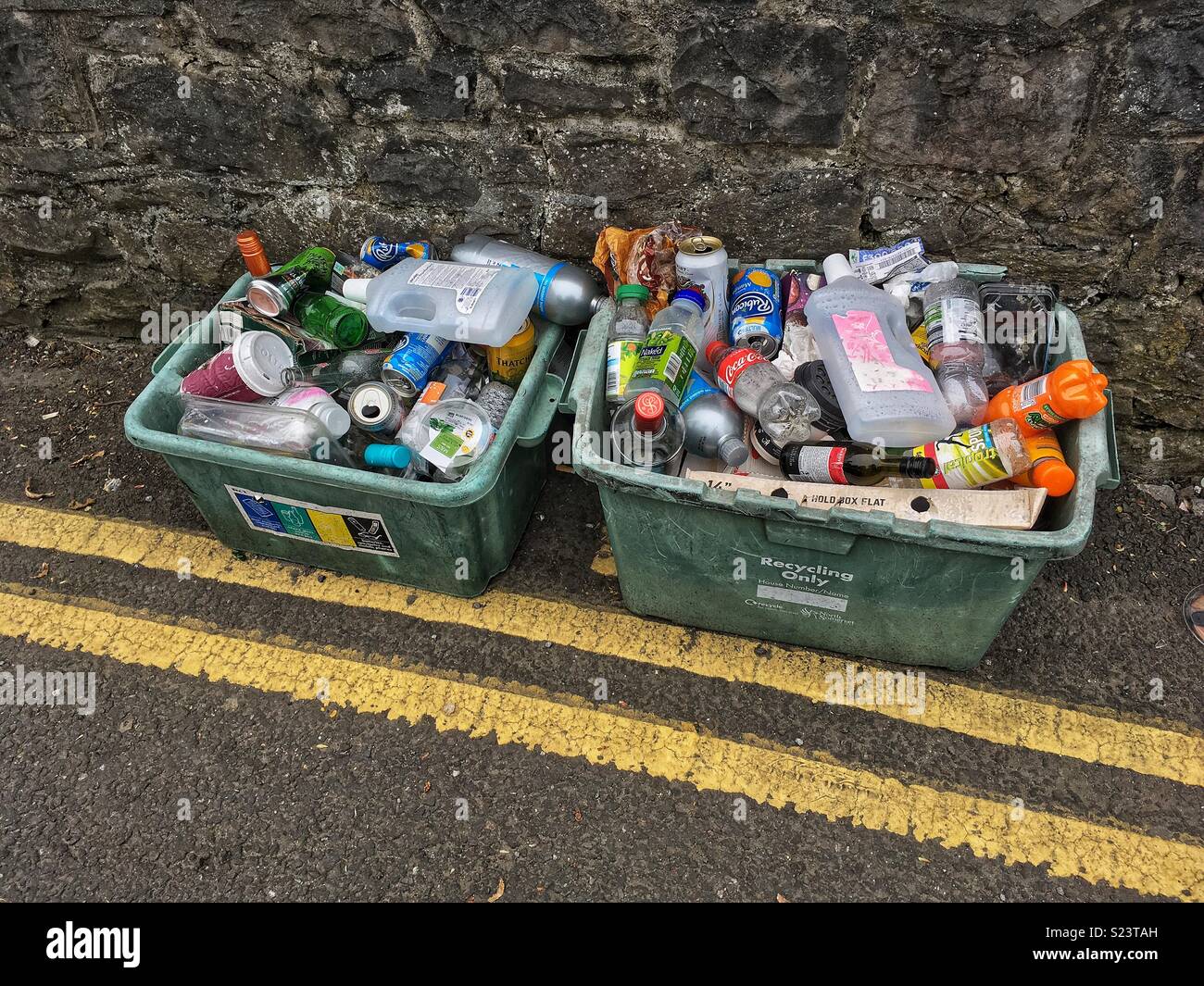 Recycling boxes awaiting collection by the roadside in Weston-super-Mare, UK Stock Photo