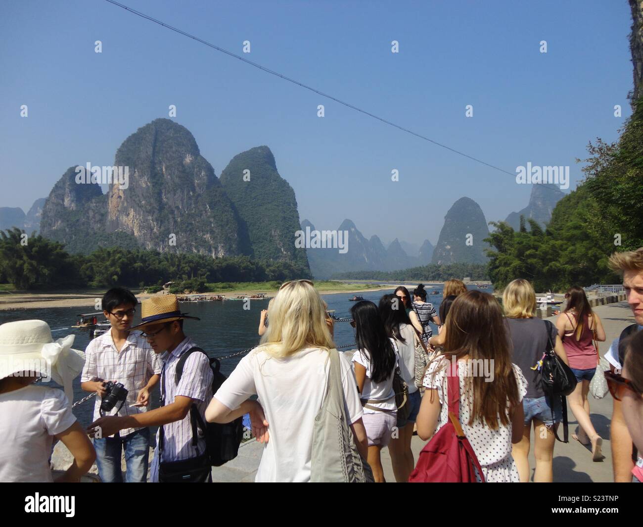 Western tourists view the mountains in Guilin, China Stock Photo