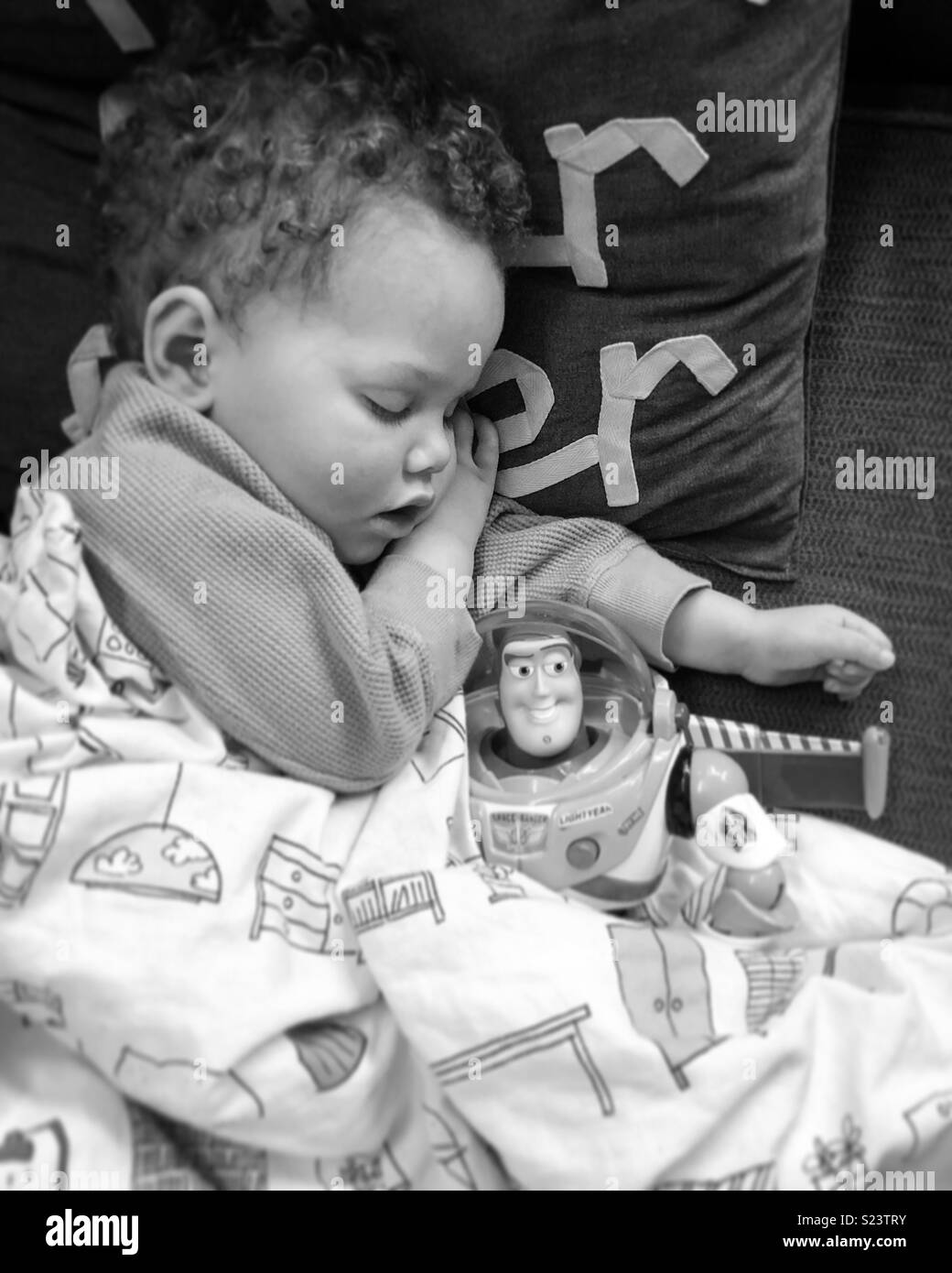 Napping baby with Buzz Stock Photo