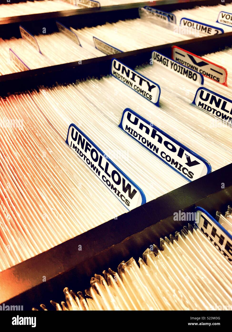 Comic books on file in Midtown comics store, NYC, USA - Smartphone Captured Stock Image