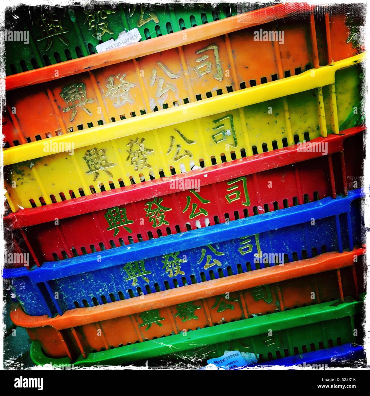 Plastic bins used for produce in the street market ('wet market') in