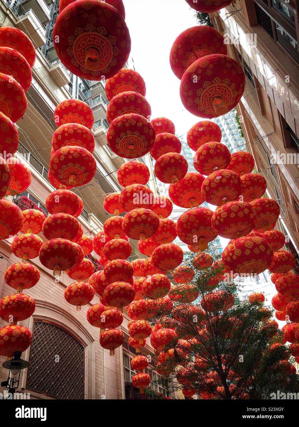 Red lanterns, traditional decorations for Chinese New Year, in Lee Tung Avenue, a shopping mall opened in 2015 on the site of old Lee Tung Street (‘Wedding Card Street’) in Wan Chai, Hong Kong - Smartphone Captured Stock Image