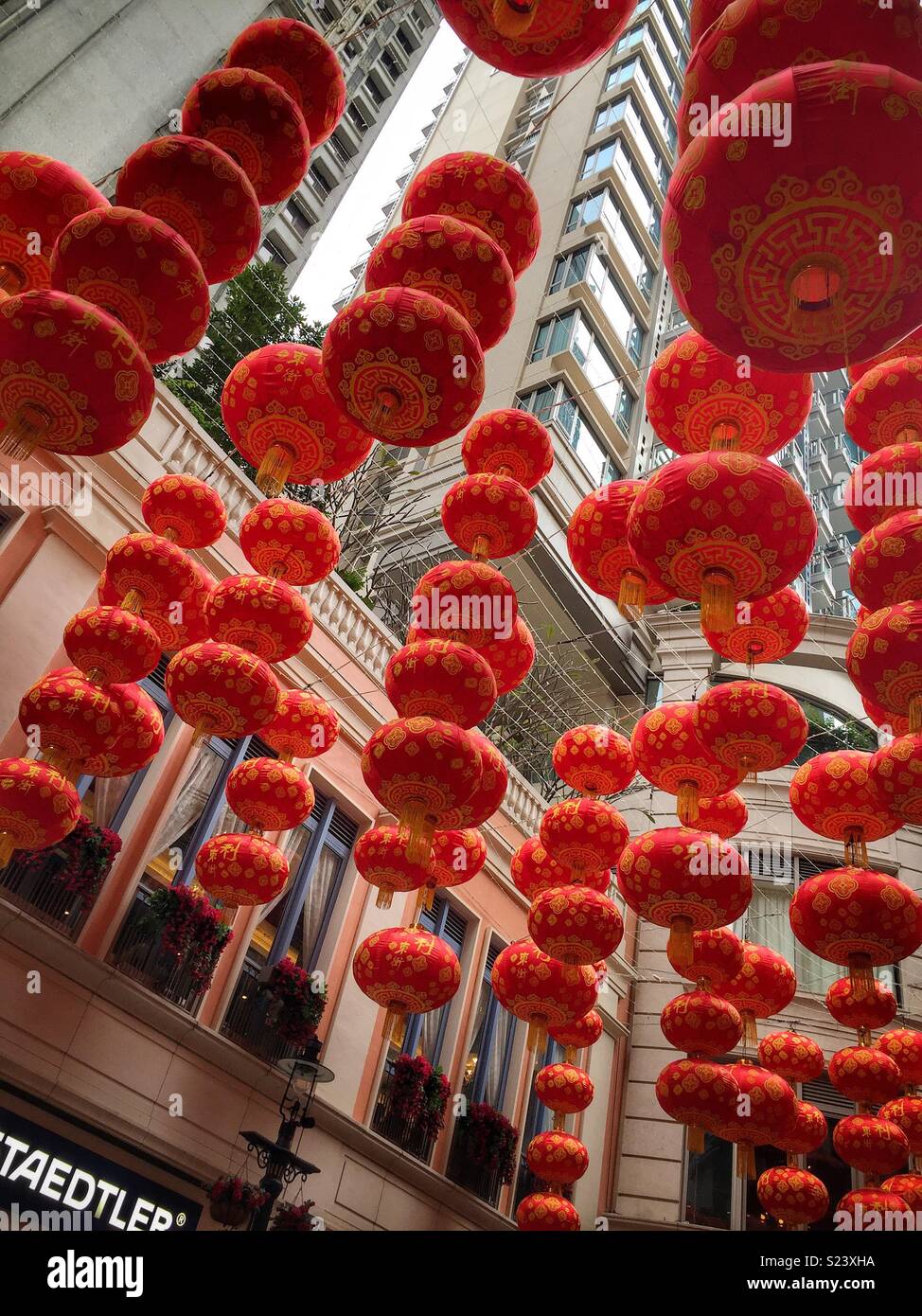 Red lanterns, traditional decorations for Chinese New Year, in Lee Tung Avenue, a shopping mall opened in 2015 on the site of old Lee Tung Street (‘Wedding Card Street’) in Wan Chai, Hong Kong - Smartphone Captured Stock Image