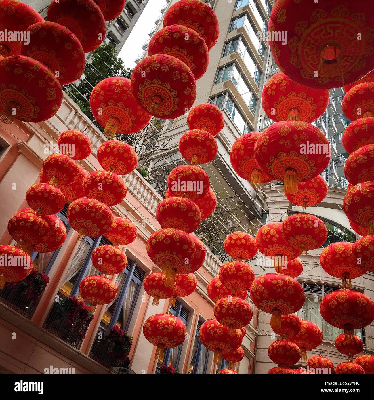 Red lanterns, traditional decorations for Chinese New Year, in Lee Tung Avenue, a shopping mall opened in 2015 on the site of old Lee Tung Street (‘Wedding Card Street’) in Wan Chai, Hong Kong - Smartphone Captured Stock Image