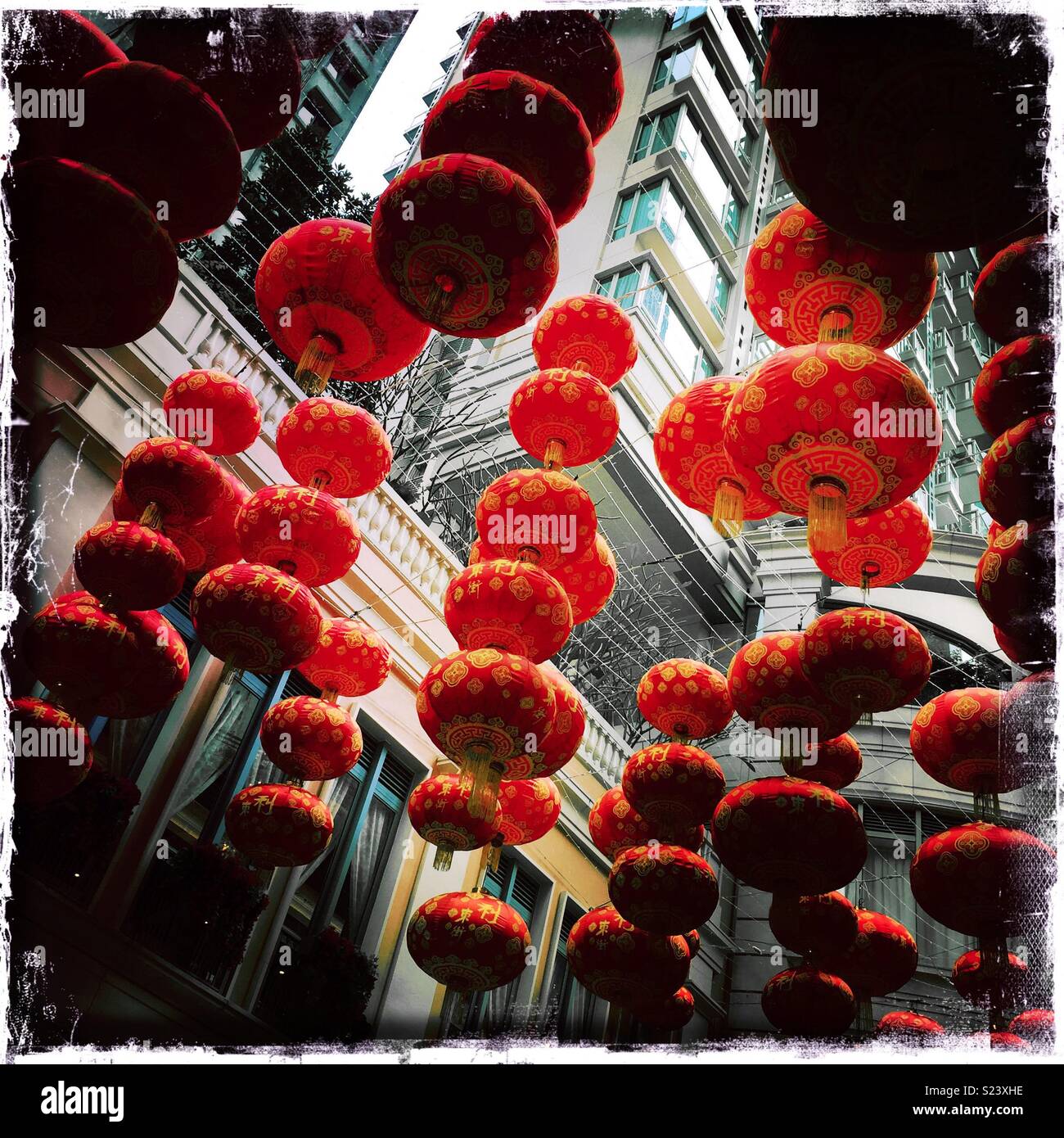Red lanterns, traditional decorations for Chinese New Year, in Lee Tung Avenue, a shopping mall opened in 2015 on the site of old Lee Tung Street (‘Wedding Card Street’) in Wan Chai, Hong Kong - Smartphone Captured Stock Image