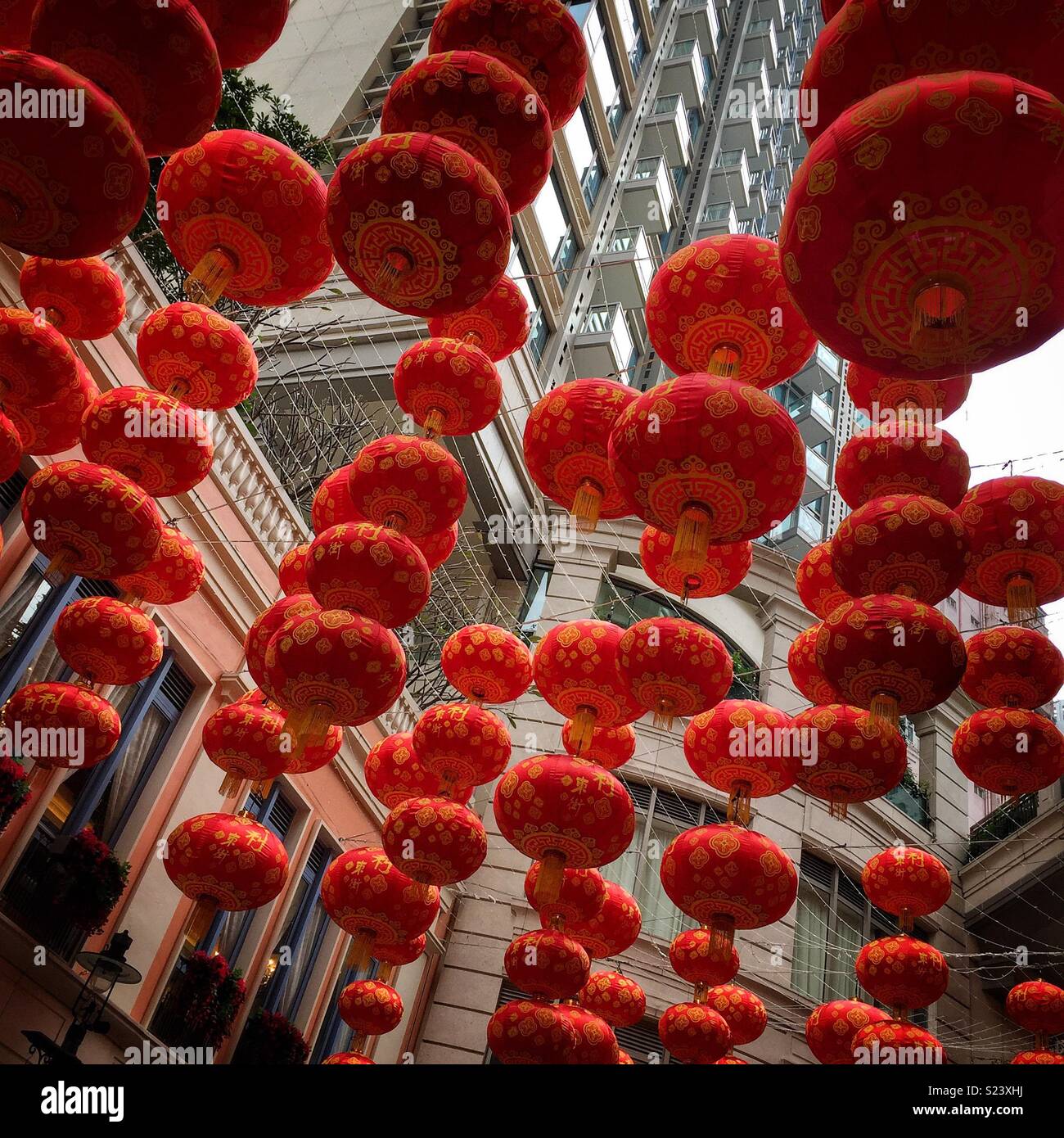 Red lanterns, traditional decorations for Chinese New Year, in Lee Tung Avenue, a shopping mall opened in 2015 on the site of old Lee Tung Street (‘Wedding Card Street’) in Wan Chai, Hong Kong - Smartphone Captured Stock Image