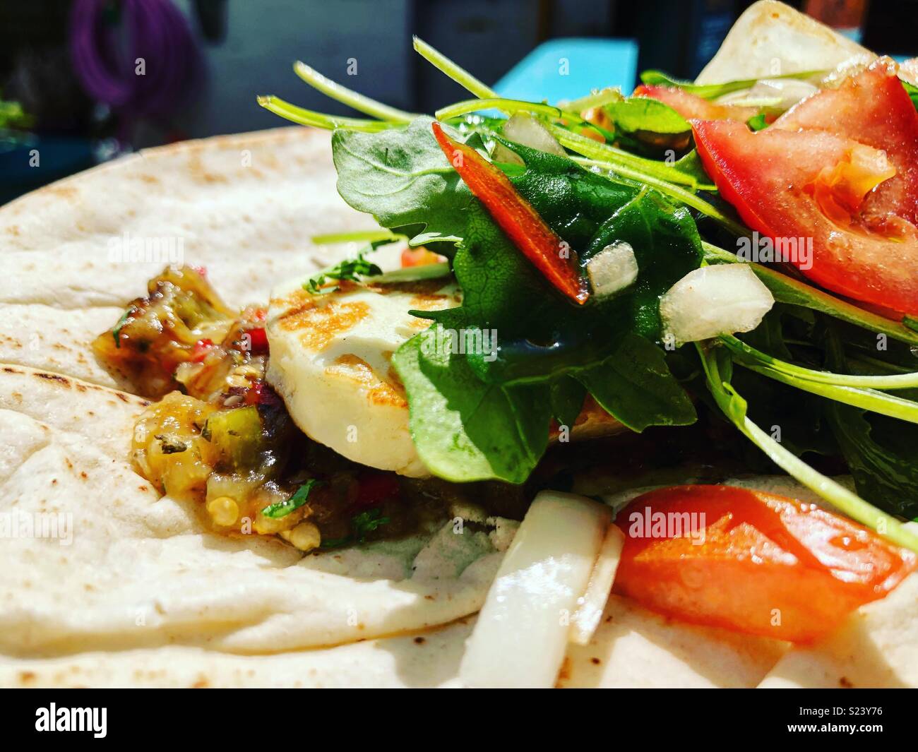 Halloumi, baba ganouj, salad on flat bread Stock Photo